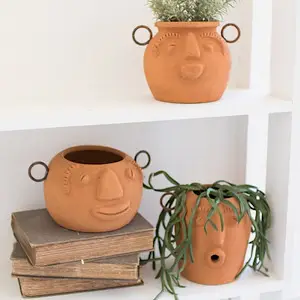 funky face clay planters